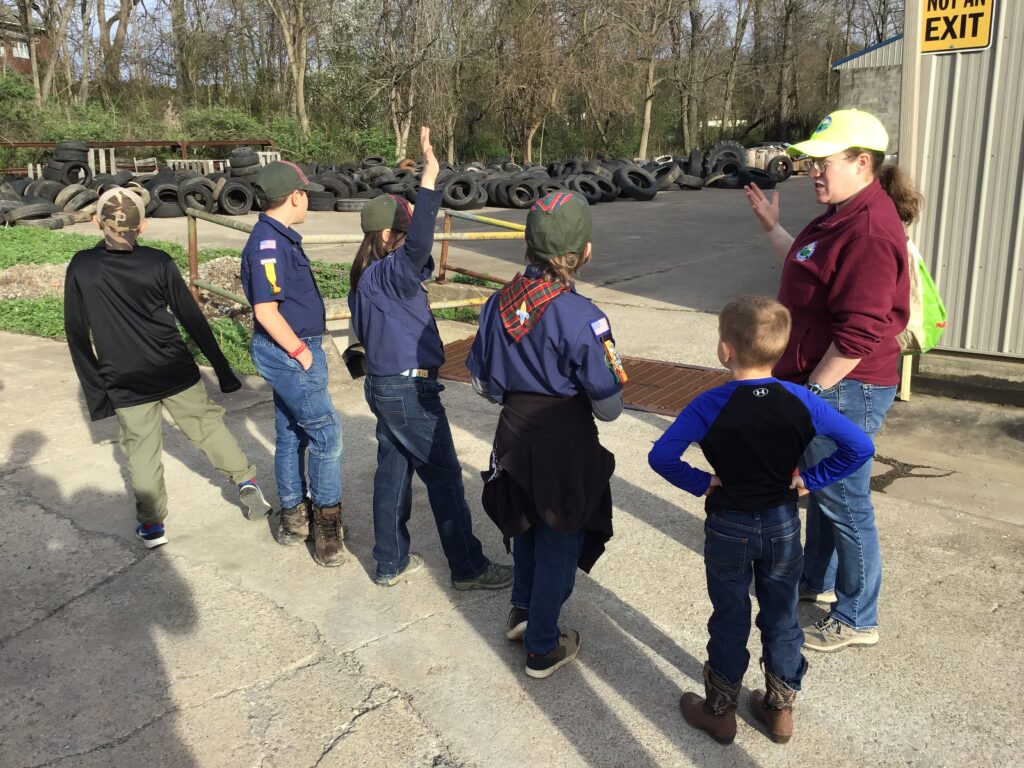 cub scouts taking a tour of the recycling center